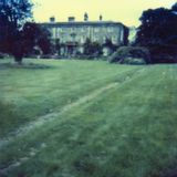 M252 View across the lawn, diagonally, showing two thirds of the front