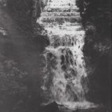 M74 Waterfall flowing from lower pond, Graves Park. Keeper standing on