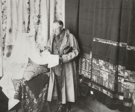 Earl Haig inspects cushions and curtains.