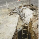 SG152 Hole in Norton Lane showing depth of sewer beneath roadway. Apri