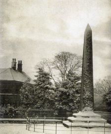 s105 Chantrey Obelisk in snow, metal fence round.  Norton House in bac